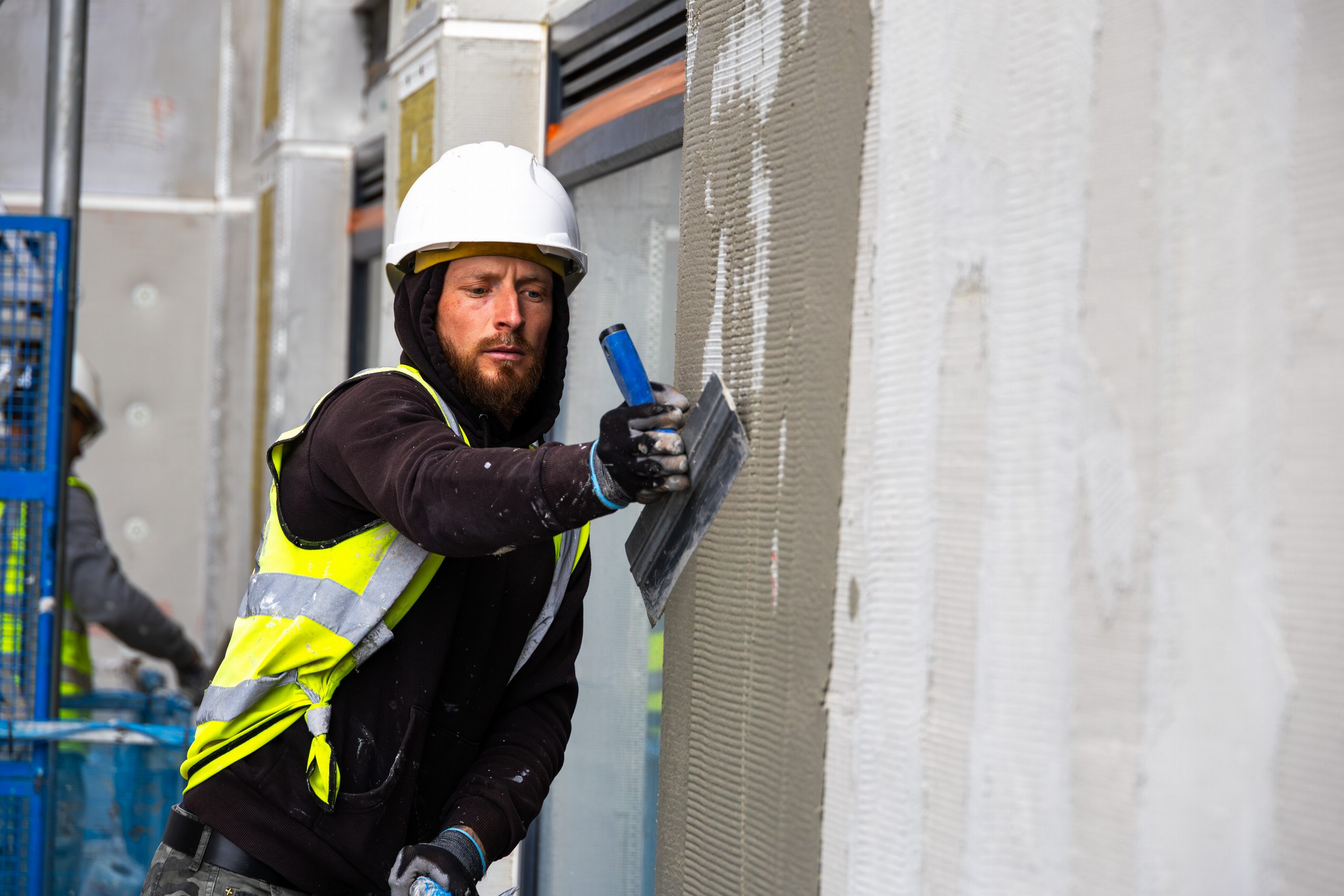 Applying render mesh on a Caparol external wall insulation project in Coventry